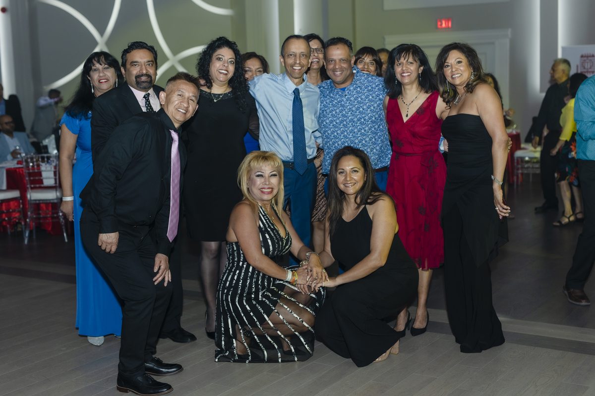 Wedding party group celebration with Memory Lane band performing