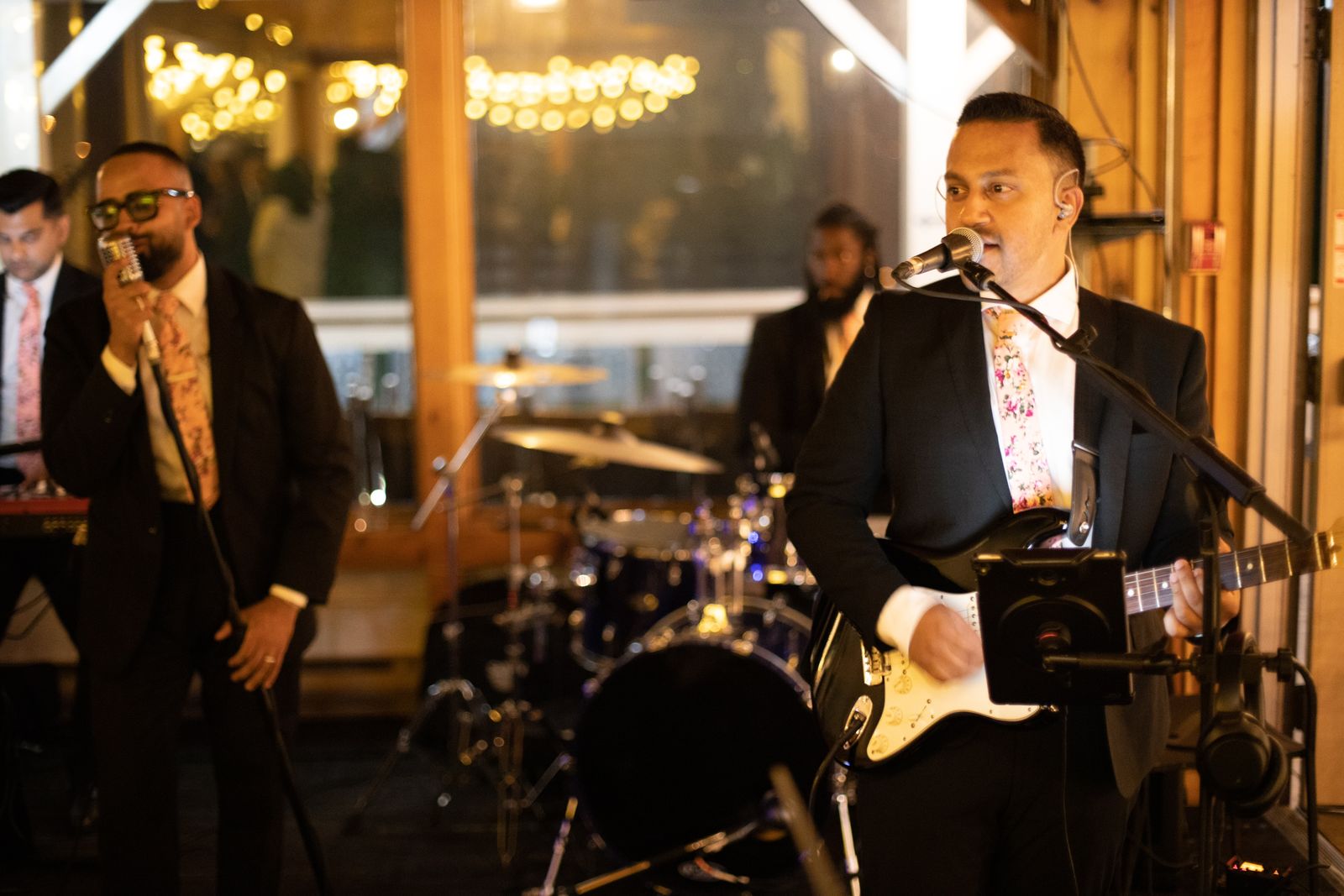 Memory Lane band members performing coordinated set on stage